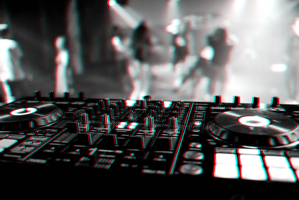 professional DJ mixer controller at a concert in a nightclub - Photo, Image