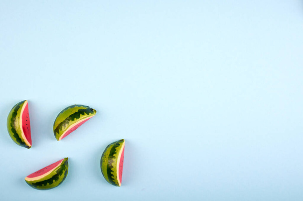 Watermelon slices composition on color background. Flat lay and overhead image. Copy space. - Photo, image