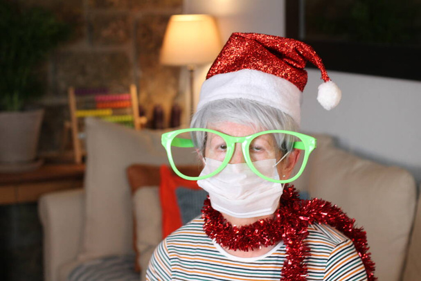 Senior woman celebrating Christmas during pandemic - Photo, Image