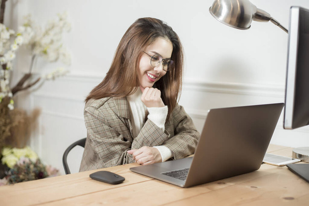 Business woman is working in her office desk  - Фото, изображение