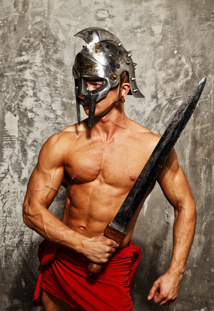 Gladiateur avec corps musclé avec épée et casque
 - Photo, image
