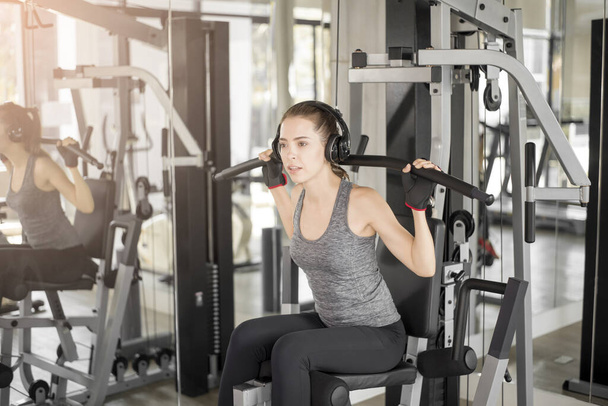 Pretty young sport woman is Workout in gym, Healthy lifestyle  - Φωτογραφία, εικόνα