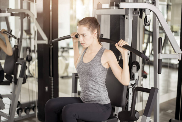 Pretty young sport woman is Workout in gym, Healthy lifestyle  - Φωτογραφία, εικόνα