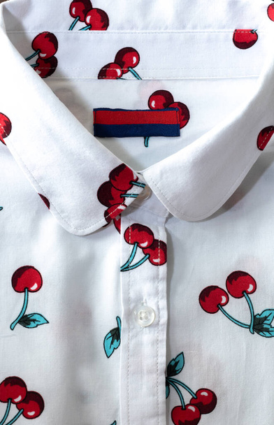 cherry ornament on a white womens blouse - Photo, Image