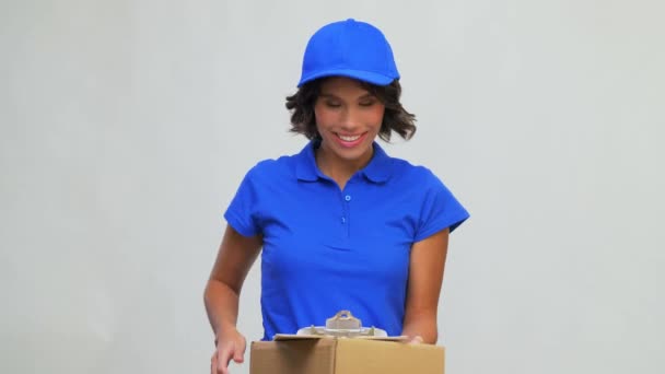happy delivery girl with parcel box and clipboard - Footage, Video