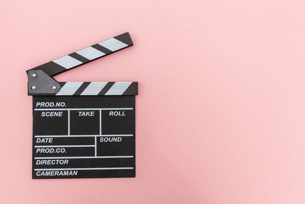 Filmmaker profession. Classic director empty film making clapperboard or movie slate isolated on pink background. Video production film cinema industry concept. Flat lay top view copy space mock up - Photo, Image