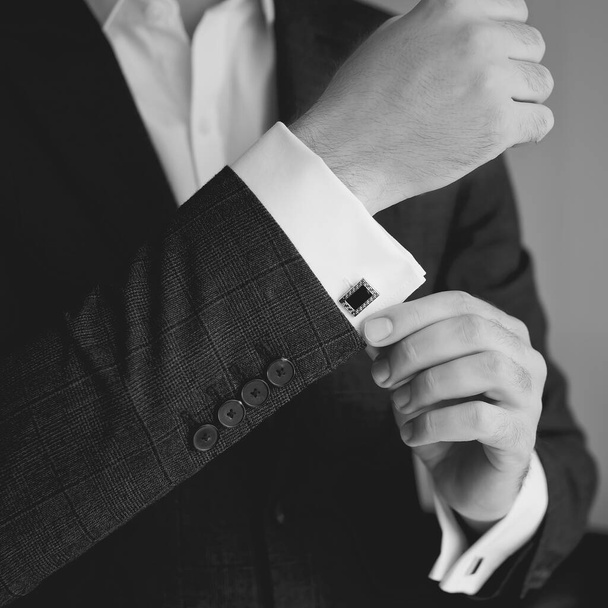 Hands of wedding groom getting ready in suit - Photo, Image