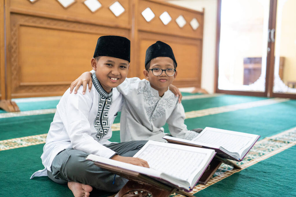 muslim asian kid bestfriend reading quran - Photo, image