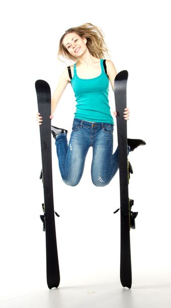 Girl holding ski in studio - Zdjęcie, obraz