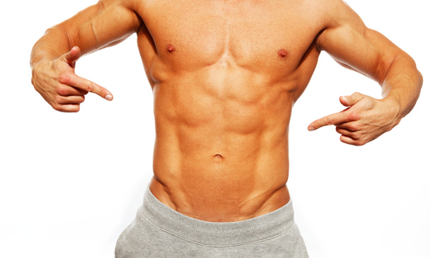 sportovní svalnatý muž ukazuje jeho břišní svaly - Fotografie, Obrázek