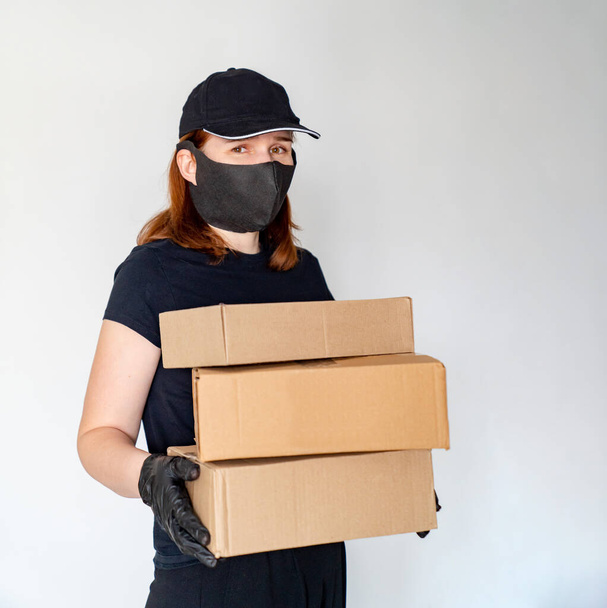 woman Delivery person holding boxes - 写真・画像