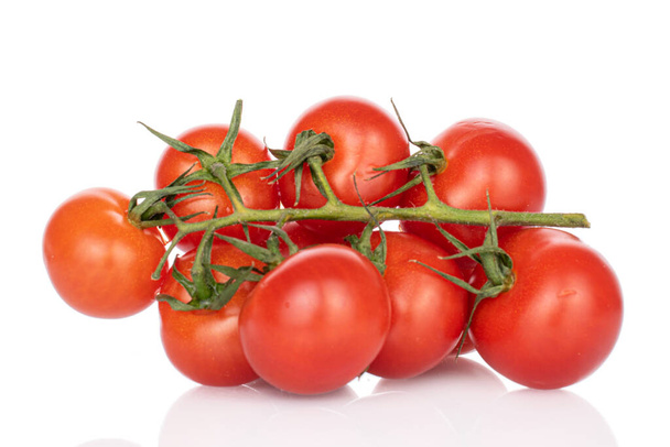 Lot of whole fresh red cherry tomato isolated on white - Foto, afbeelding