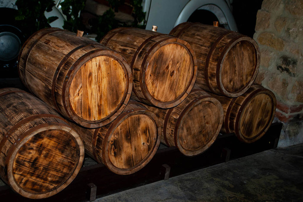 The image of wine barrels stacked in the cellar. Oak barrels.  - Photo, Image