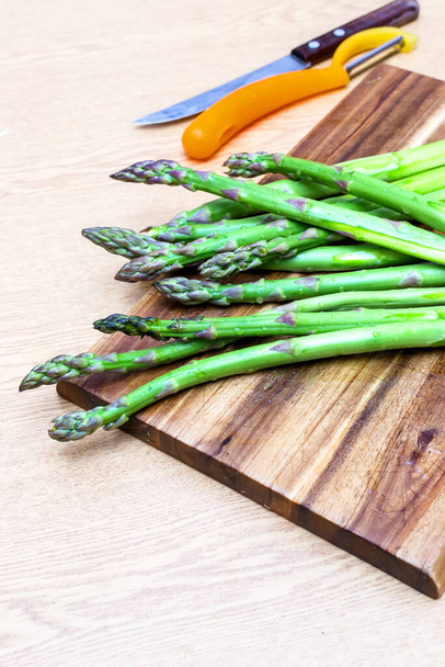 Asparagus on a wooden board prepared for tart cooking - Foto, immagini