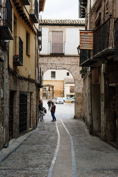 Picturesque cobblestoned street in the medieval town of Pastrana - 写真・画像