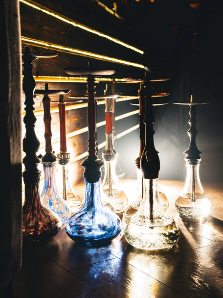 Row of different hookahs in a staff-room in a dramatic light - Photo, Image