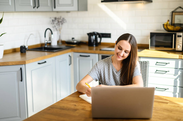 A young woman is studying online at home - Valokuva, kuva