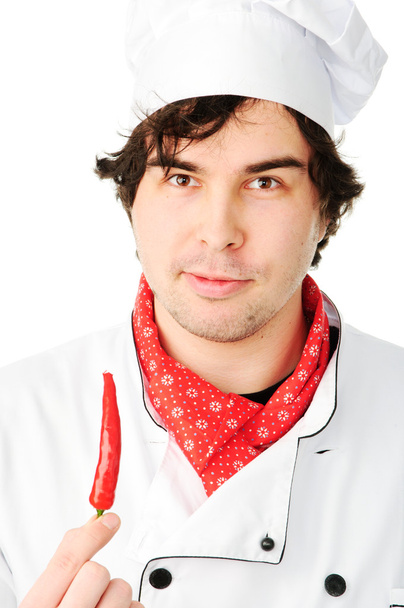 Chef in uniform holding hot chili pepper - Foto, immagini