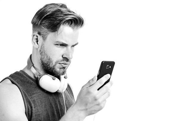 Inspiring music concept. Man handsome unshaven hipster listen music using headphones gadget. Listen music for motivation and inspiration. Audio quality. Modern earphones. Music application smartphone - Photo, Image