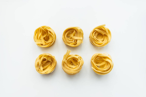 Italian wheat pasta tagliatelle isolated. - Фото, изображение