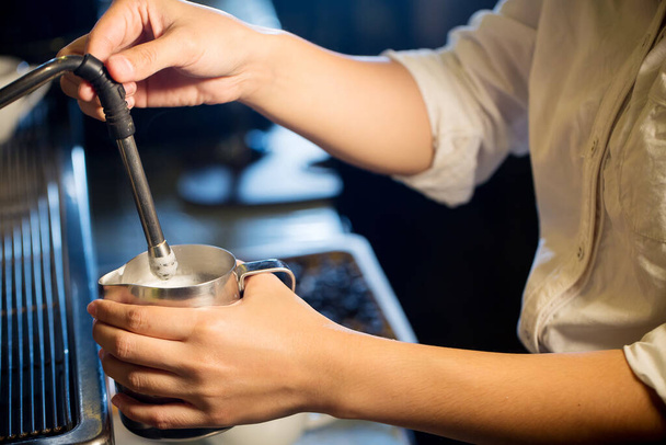 barista pouring coffee in cafe - Photo, image