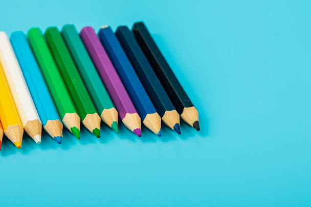 portrait of set of colorful pencils on blue background with copy space - Photo, Image