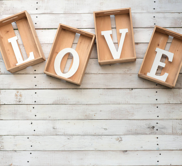 wooden letters with word love on white background - Fotó, kép