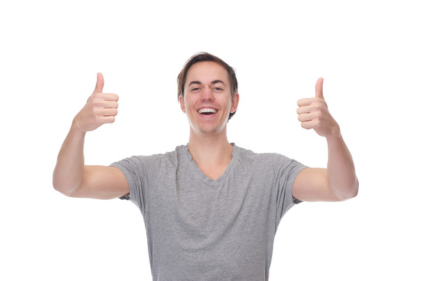 Portrait of a cheerful man smiling with thumbs up - Photo, Image