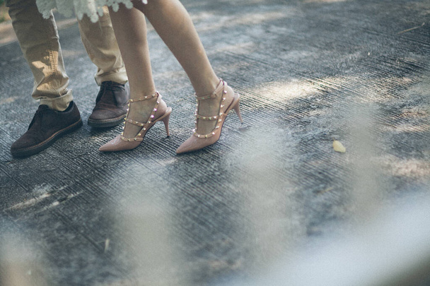 feet of a young couple in a dance studio - Фото, зображення