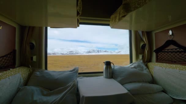 CLOSE UP: Scenic view of Tibetan plains through the window of a sleeper train. - Footage, Video
