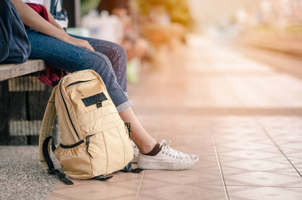 young woman traveler wearing backpack waiting. - Photo, Image