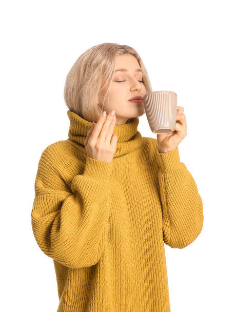 Beautiful young woman with tea on white background - Φωτογραφία, εικόνα