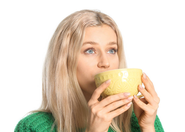 Beautiful young woman with tea on white background - Zdjęcie, obraz