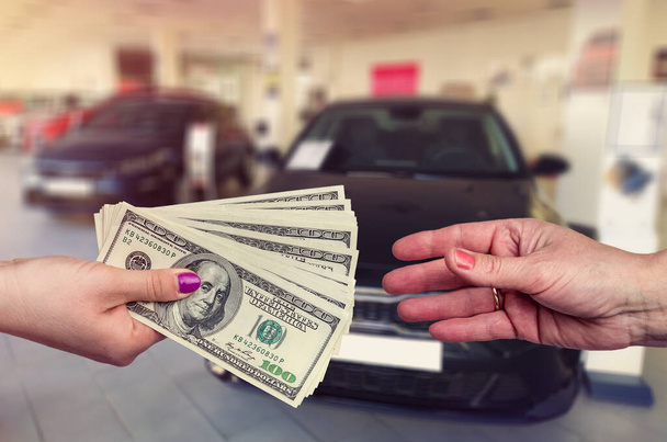 Buying a new car. The buyer and seller enter into an agreement to buy or lease a car. - Fotó, kép