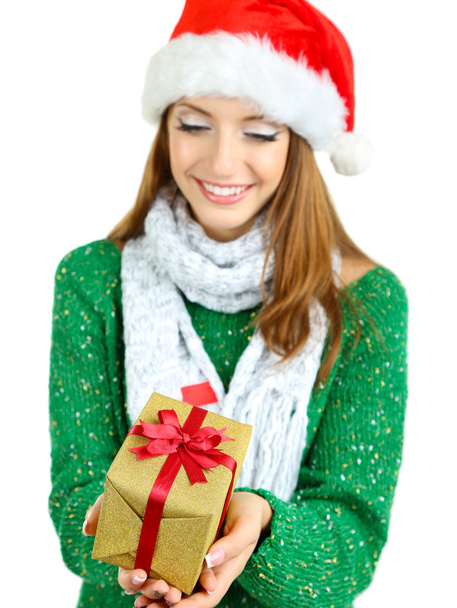 Beautiful smiling girl in New Year hat with gift isolated on white - Фото, зображення