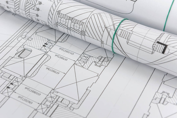 Technical drawings with blueprints in rolls close up. Engineering concept - Photo, Image