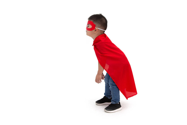 Asian boy with funny little power of hero isolated on white background, Superhero concept - Foto, afbeelding