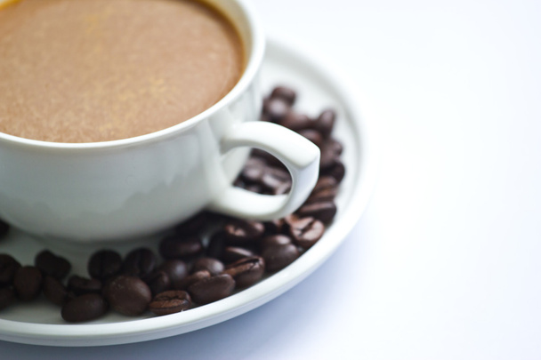 Kávécsésze és kávébab - Fotó, kép