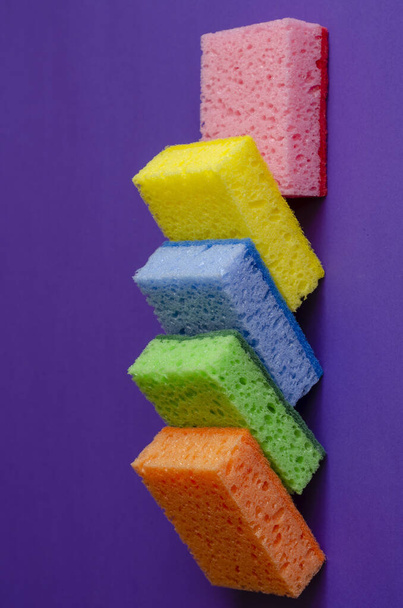 Kitchen multi-colored sponges. Five porous kitchen sponges in various colors. Commercial cleaning company. Close-up. Selective focus. - Foto, Imagem