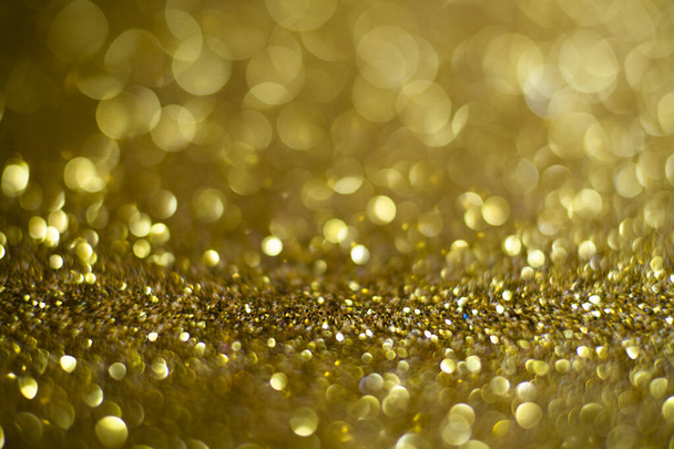 Abstract of Bright and sparkling bokeh background. golden and diamond dust bokeh - blurred lighting from glitter texture. Blue color Luxury design background. Gold festive glitter background with bokeh golden lights. - 写真・画像