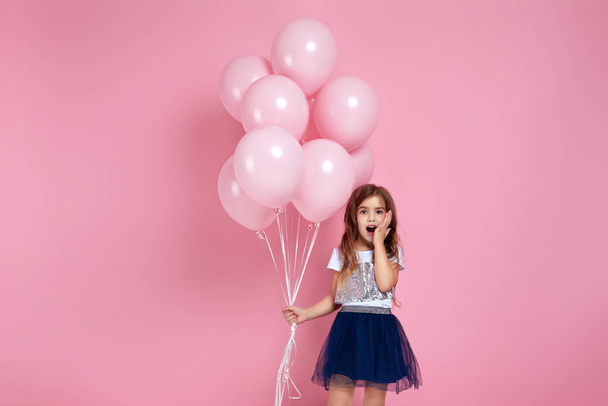 child girl posing with pastel pink air balloons - Фото, зображення