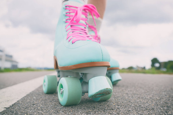 Woman rollerskater wearing roller skates with pink laces - Photo, Image