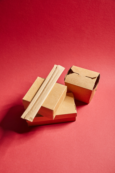 top view of takeaway carton boxes with traditional chinese food on red - Photo, Image