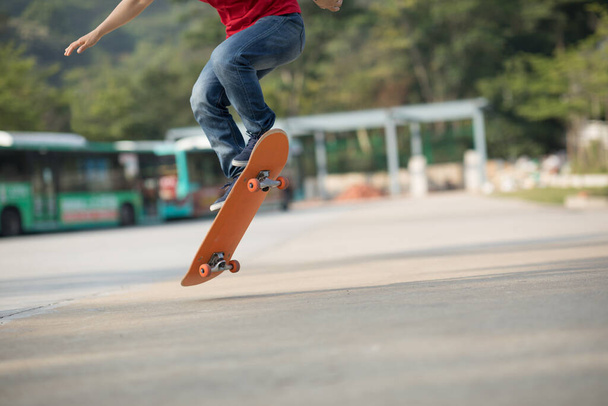 view on Skateboarder legs, skateboarding and tricks at outdoors - Foto, Imagen
