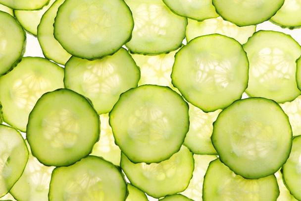 Many cucumber slices as background - Foto, imagen