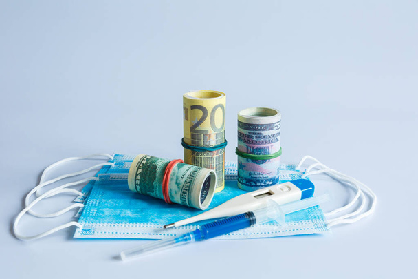 Banknotes of American and European currency among medical products and items. - Foto, Imagem