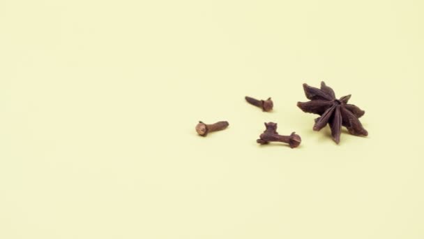 Spices cloves and star anise on a yellow background. - Footage, Video