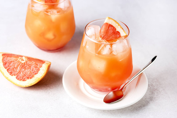 Glasses of Cold and Tasty Pink Grapefruit Juice Decorated with Slice of Ripe Grapefruit Cold Juice or Beverage Horizontal - Fotoğraf, Görsel
