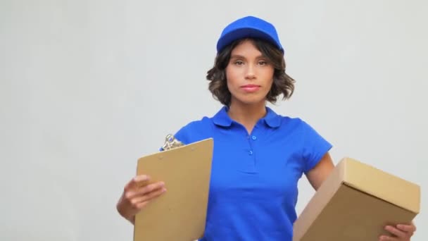 happy delivery girl with parcel box and clipboard - 映像、動画