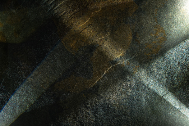light prism with beams on dark stone texture background - Фото, изображение